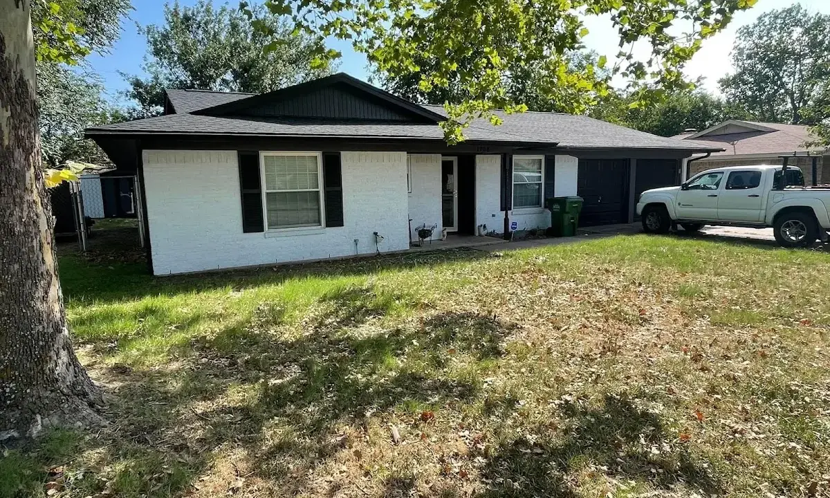 Professional roofing crew working on a residential roof in Sedona